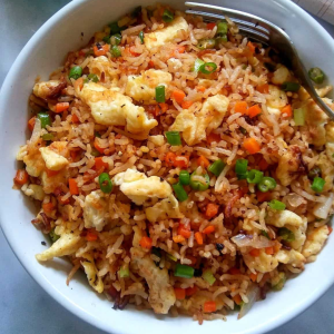 Stir-fried rice with vegetables, chicken, or egg