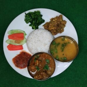 Traditional Nepali Khana Set with rice, dal, vegetable curry, pickle and salad at BhansaX
